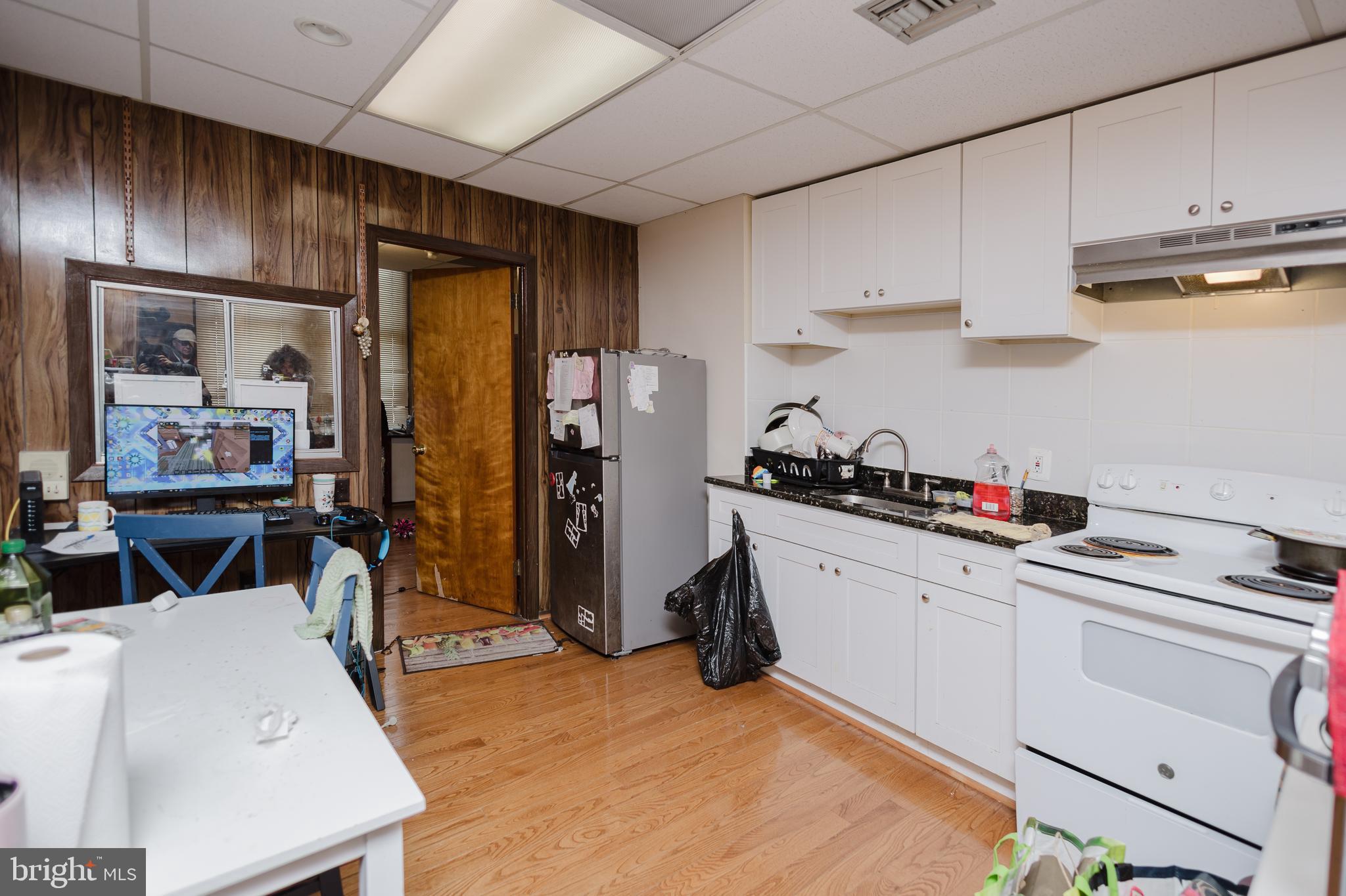2318 South Broad Street Philadelphia, PA 19145 - Photo 8 of 28 a kitchen with cabinets a sink and appliances