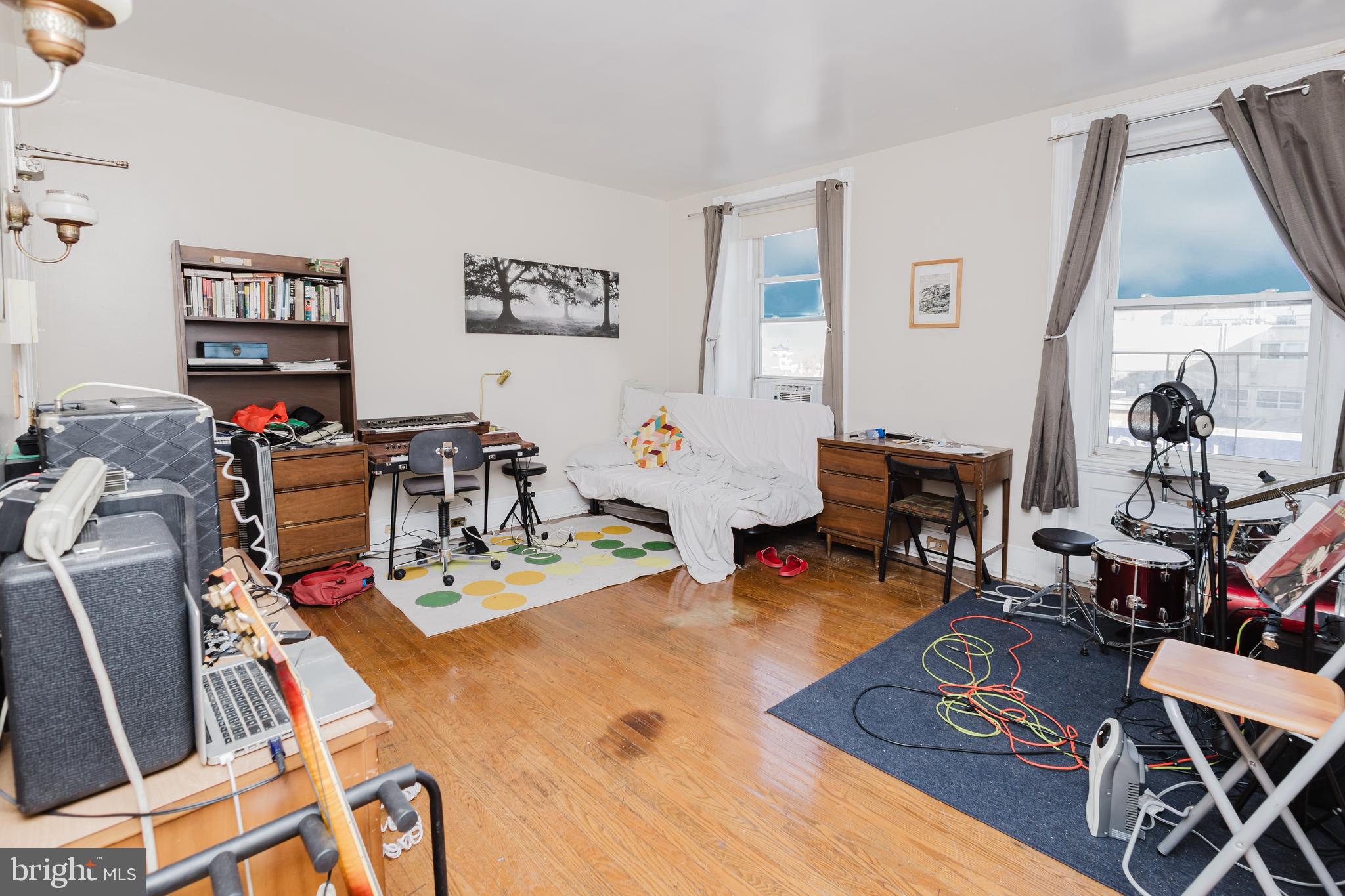 2318 South Broad Street Philadelphia, PA 19145 - Photo 10 of 28 a work room with furniture a rug and white walls