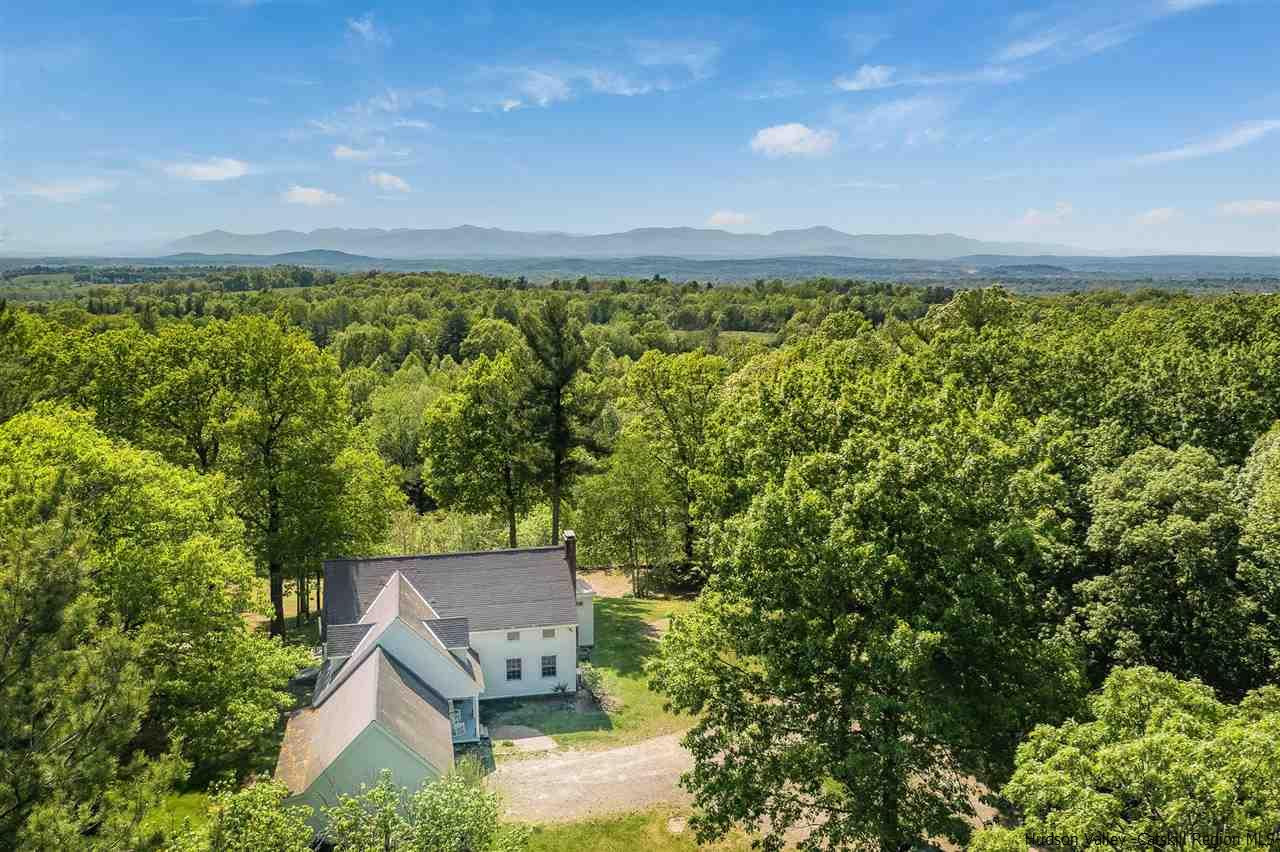 an aerial view of a house with a garden