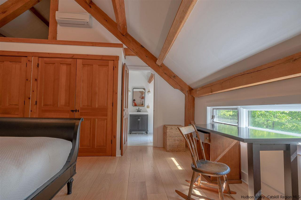 306 Thielman Road Hudson, NY 12534 - Photo 11 of 35 a view of a livingroom with furniture wooden floor and windows