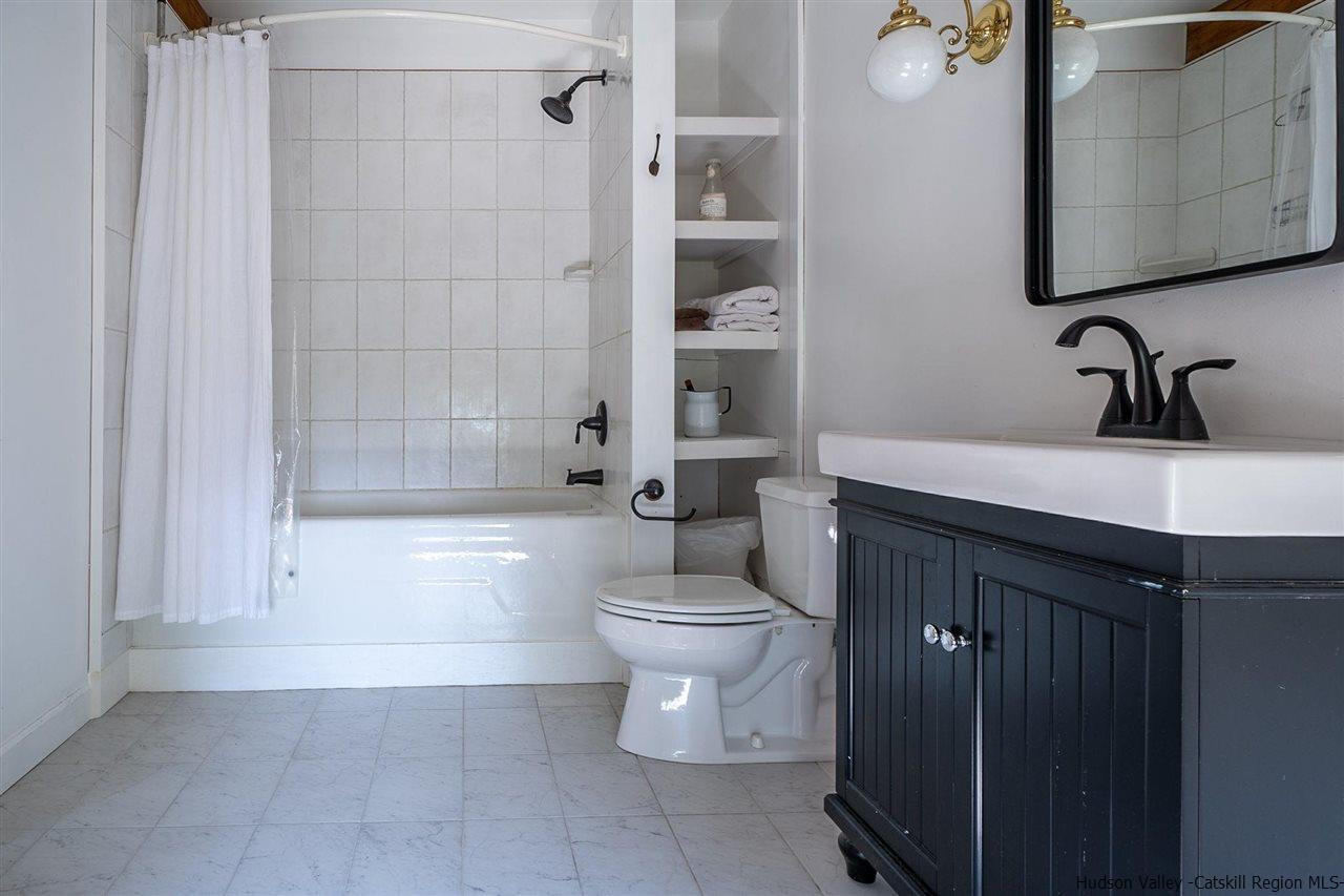 306 Thielman Road Hudson, NY 12534 - Photo 15 of 35 a bathroom with a sink a toilet and shower