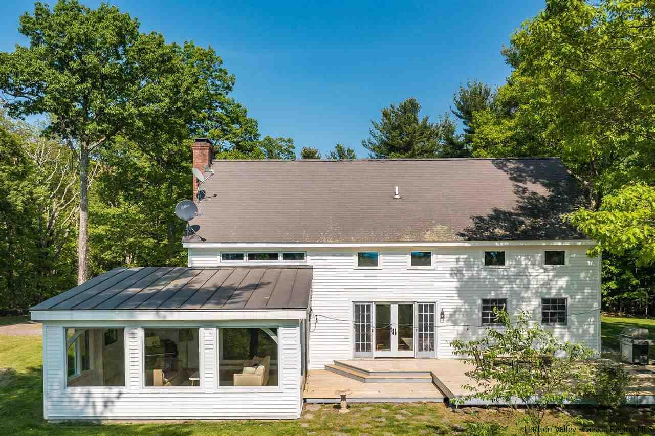 306 Thielman Road Hudson, NY 12534 - Photo 18 of 35 front view of a house with a garden