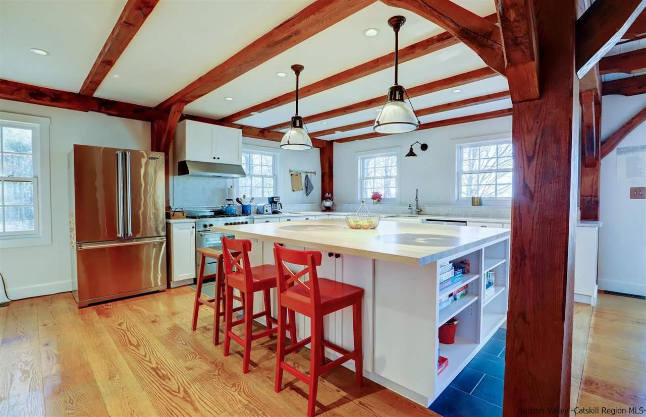 306 Thielman Road Hudson, NY 12534 - Photo 19 of 35 a kitchen with stainless steel appliances granite countertop a sink and a refrigerator