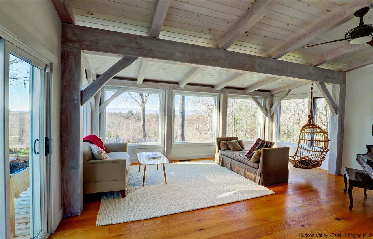 306 Thielman Road Hudson, NY 12534 - Photo 21 of 35 a living room with furniture and a table