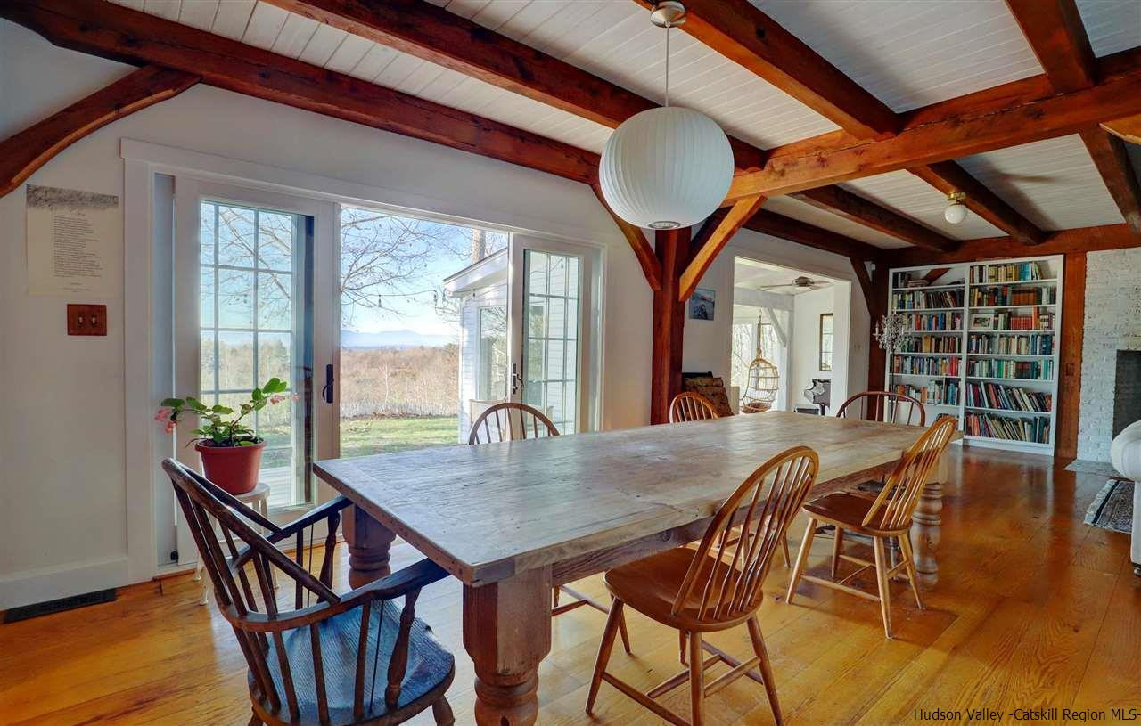 306 Thielman Road Hudson, NY 12534 - Photo 24 of 35 a view of a dining room with furniture window and wooden floor