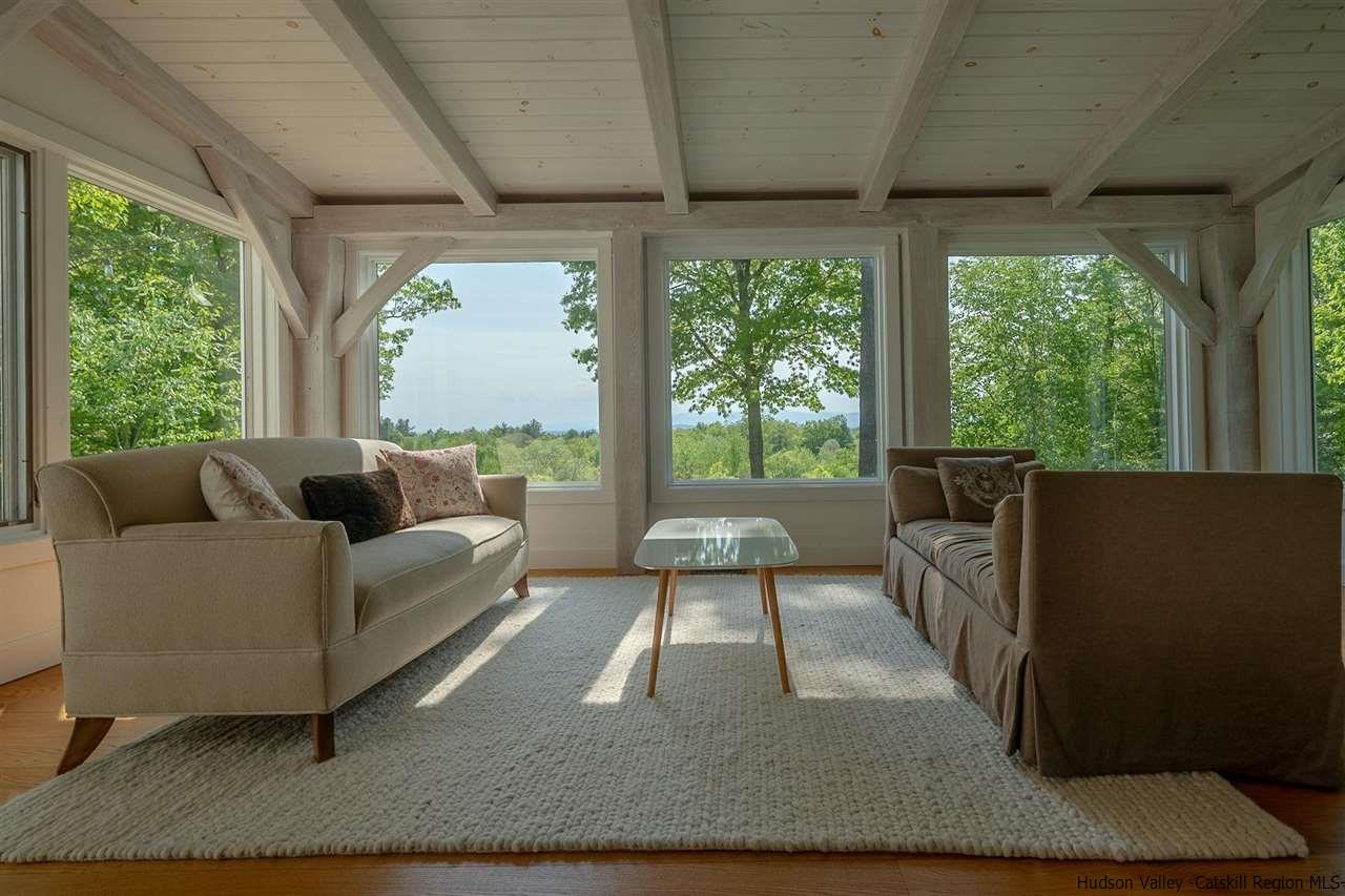 306 Thielman Road Hudson, NY 12534 - Photo 28 of 35 a living room with furniture and a large window
