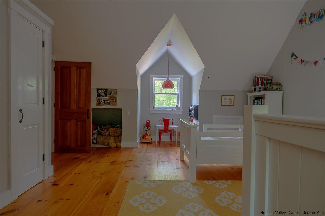 306 Thielman Road Hudson, NY 12534 - Photo 29 of 35 a living room with furniture and a flat screen tv