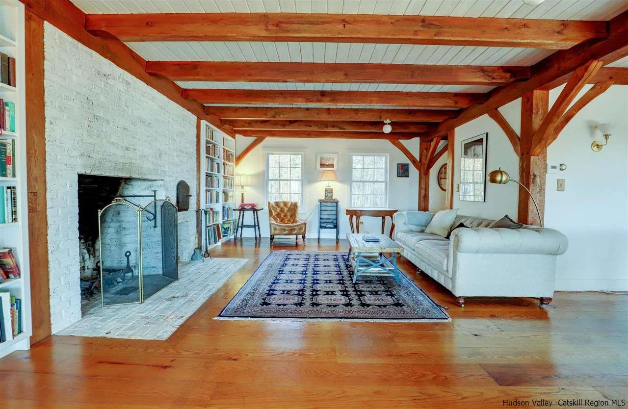 306 Thielman Road Hudson, NY 12534 - Photo 3 of 35 a living room with furniture and a rug