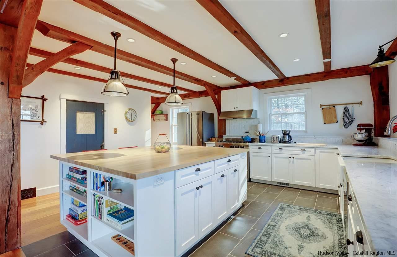 306 Thielman Road Hudson, NY 12534 - Photo 4 of 35 a kitchen that has a lot of cabinets in it