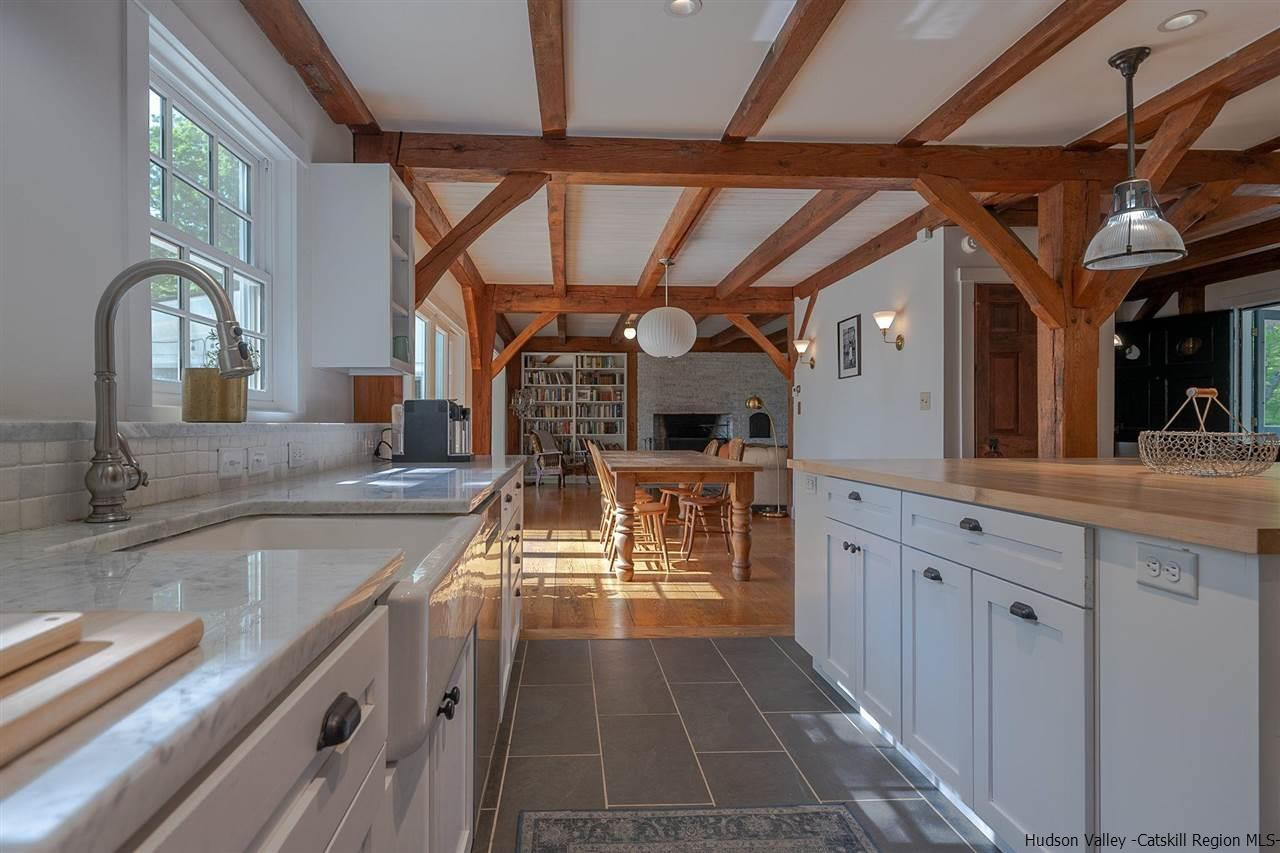 306 Thielman Road Hudson, NY 12534 - Photo 7 of 35 a kitchen with stainless steel appliances granite countertop a sink and cabinets