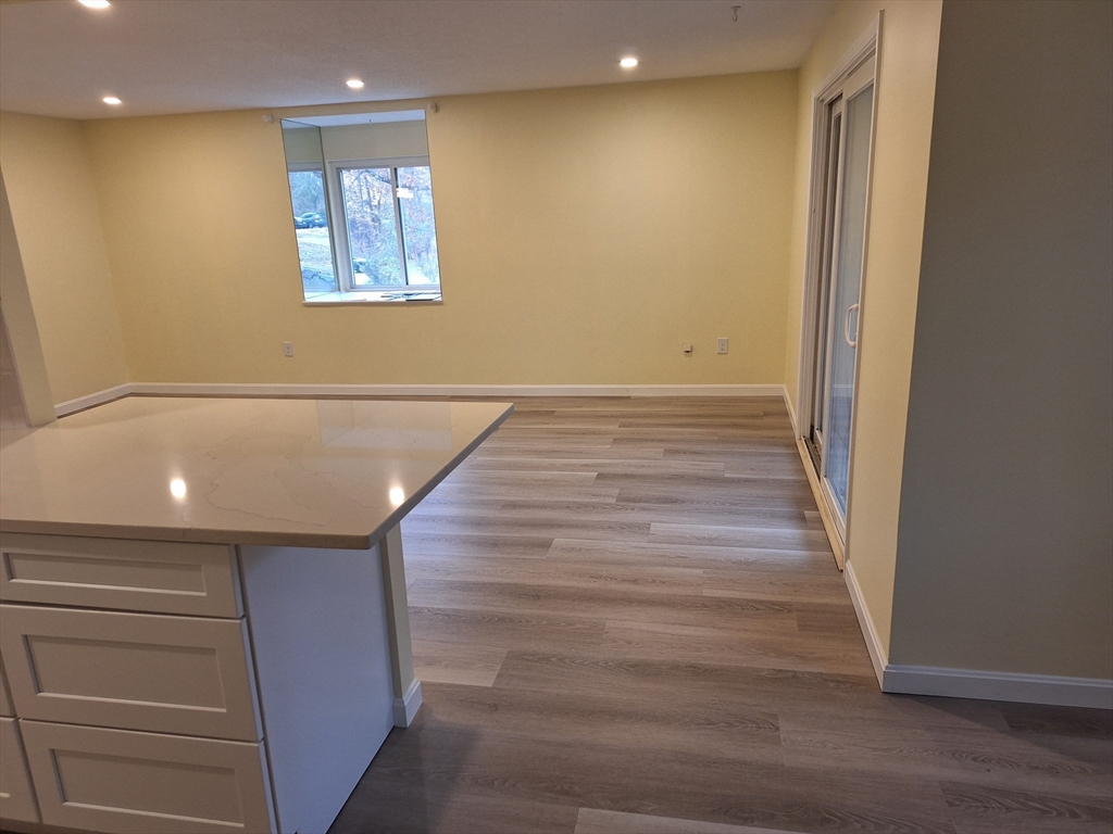 10 Beal's Cove Road, Unit C Hingham, MA 02043 - Photo 3 of 10 a view of room with wooden floor and staircase