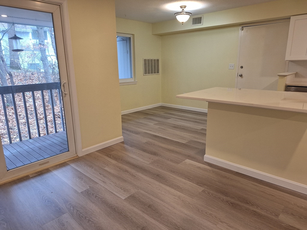 10 Beal's Cove Road, Unit C Hingham, MA 02043 - Photo 10 of 10 a room with a bed and wooden floor