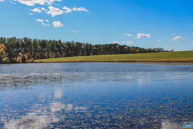 a view of ocean with green space