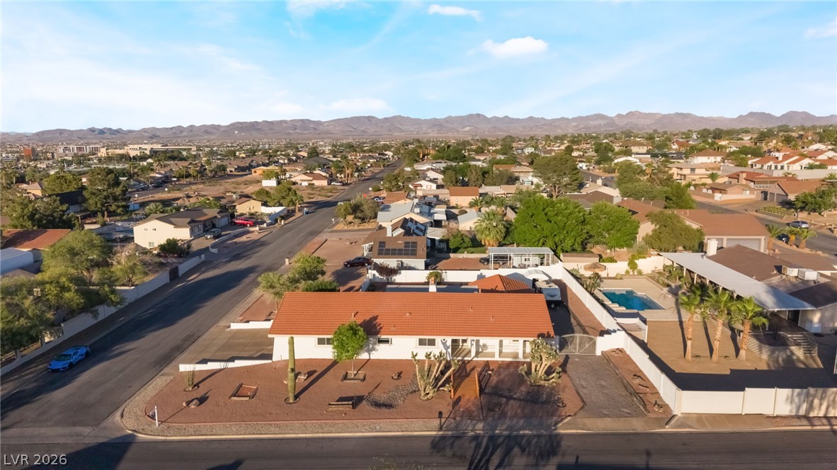 429 Crestway Road Henderson, NV 89015 - Photo 52 of 56 An aerial perspective reveals this desert oasis featuring a tile roof, private pool, and mature landscaping.