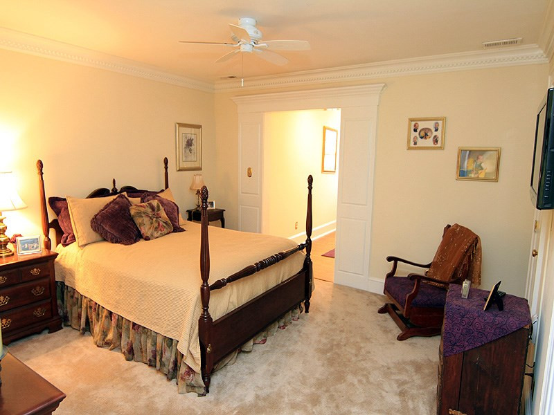 2204 Customs House Court Raleigh, NC 27615 - Photo 21 of 25 The upstairs bedrooms have super cushy carpet, each with an alcove dormer that can be a sitting/play area. Walk-in closets, storage access...joined by a shared bath. Bedroom
