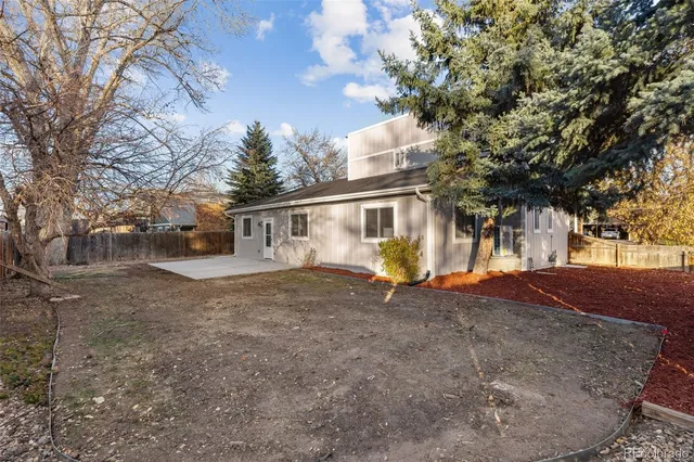 a view of a house with a tree