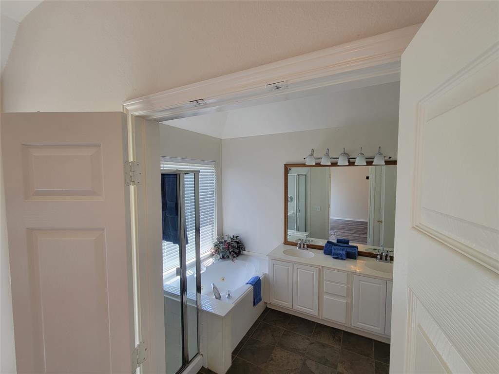 2913 Rush Creek Road McKinney, TX 75072 - Photo 6 of 32 Bathroom featuring tile patterned flooring, separate shower and tub, and double vanity