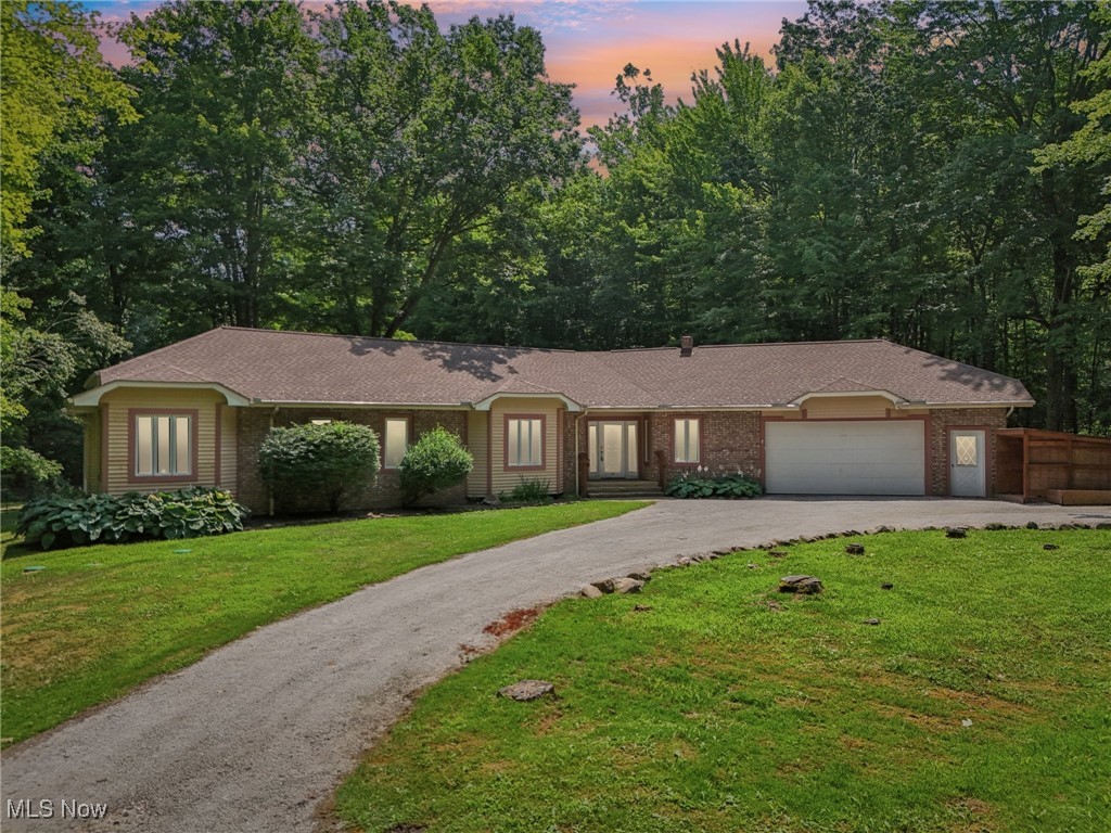 5643 Chapin Road Madison, OH 44057 - Photo 1 of 50 Ranch-style house featuring driveway, an attached garage, and brick siding