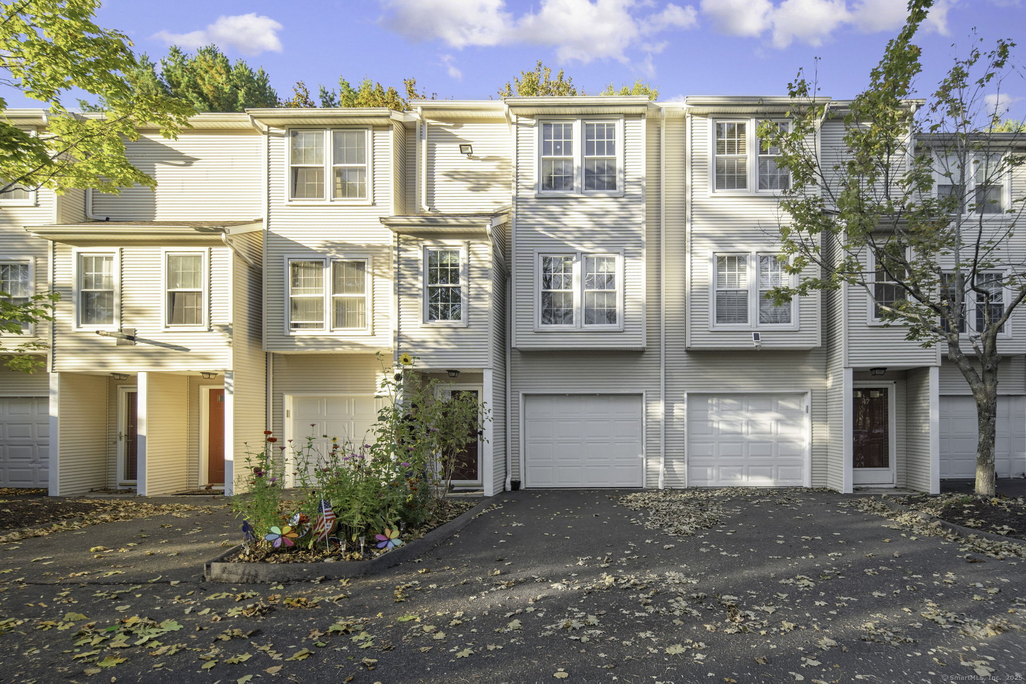 a view of a brick building next to a road