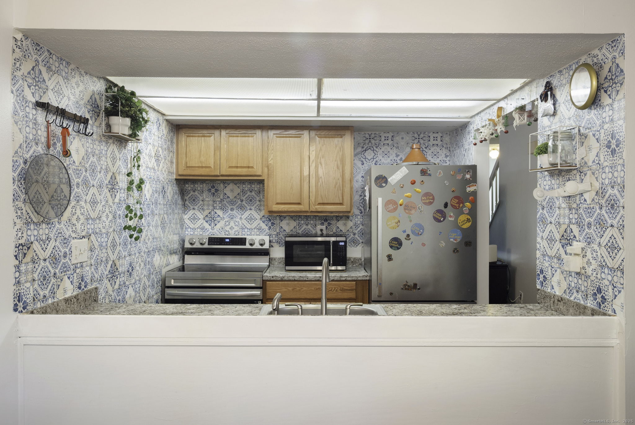 380 Hitchcock Road, Unit 48 Waterbury, CT 06705 - Photo 11 of 28 a living room with furniture and a fireplace