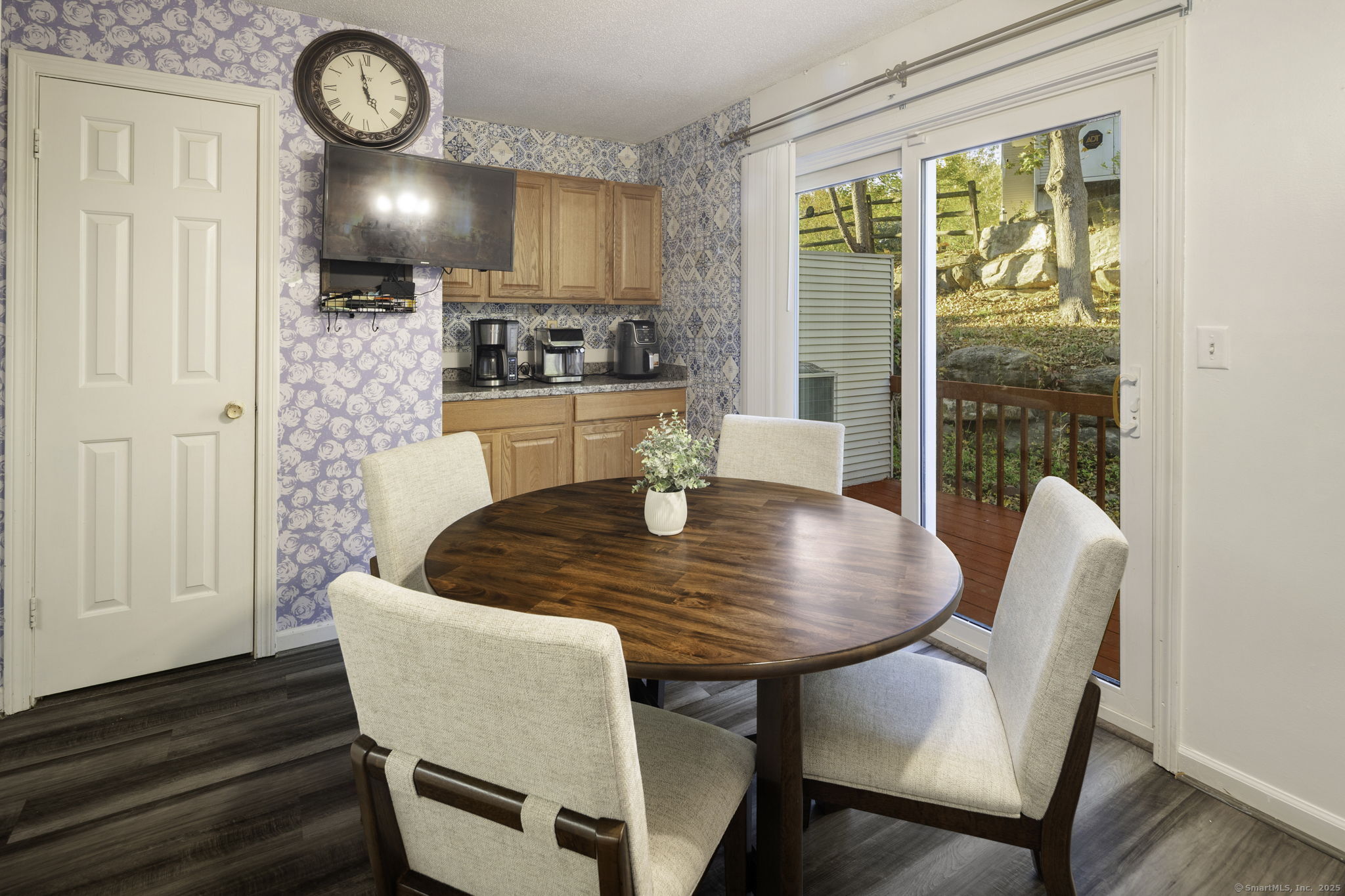 380 Hitchcock Road, Unit 48 Waterbury, CT 06705 - Photo 12 of 28 a dining room with furniture a window and wooden floor