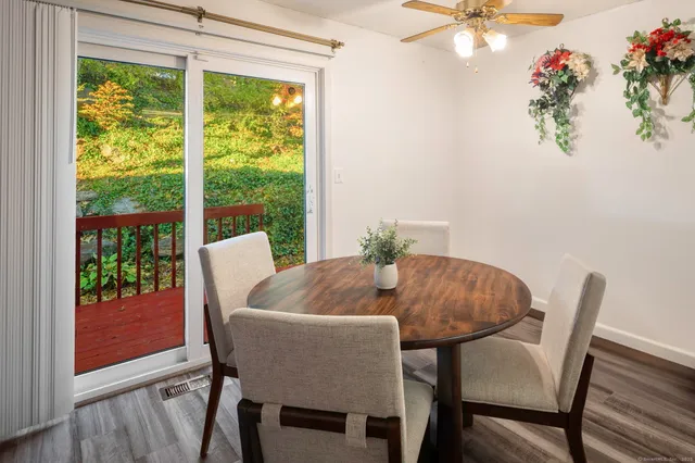 a view of a dining room with furniture window and outside view