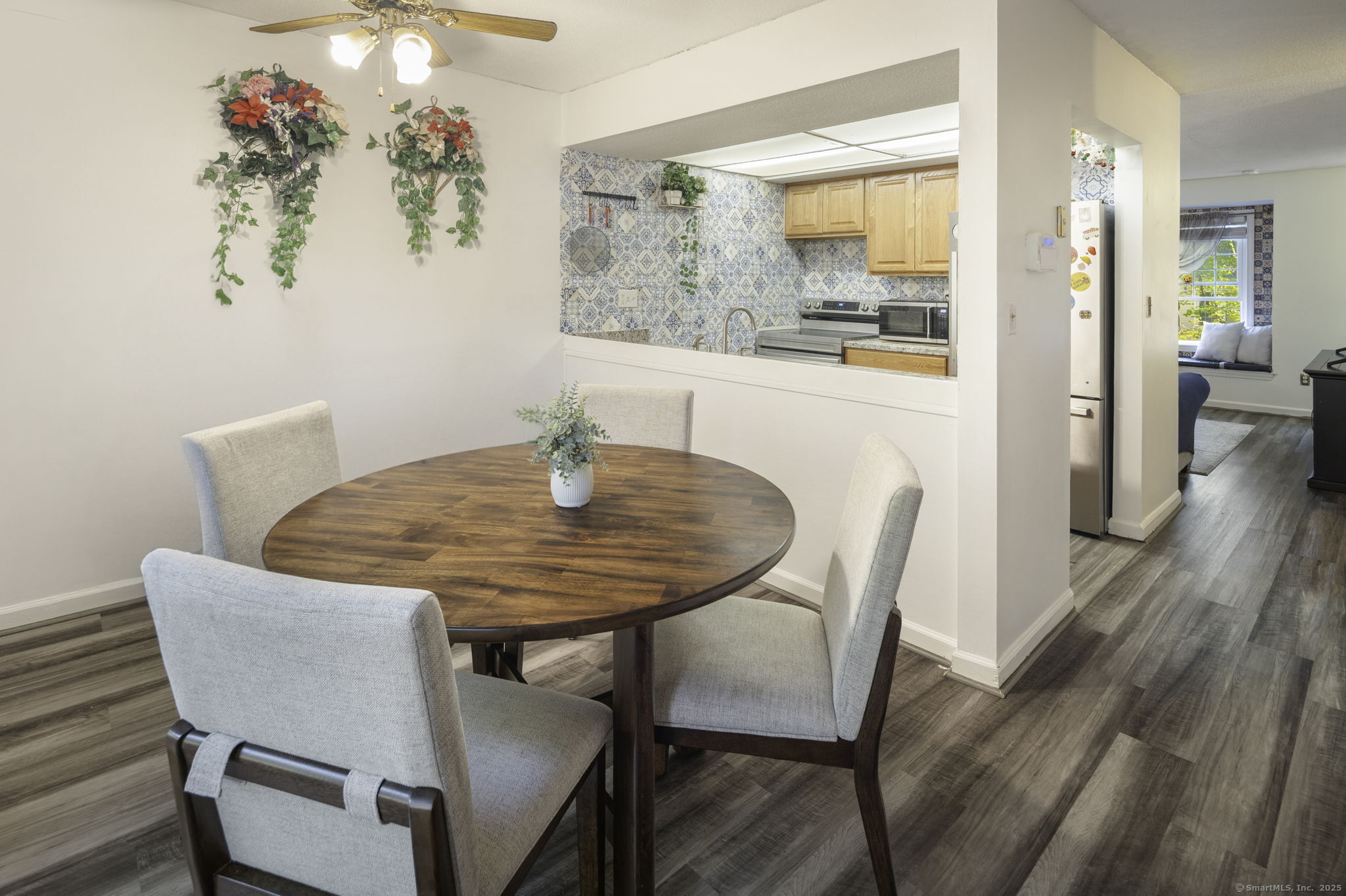 380 Hitchcock Road, Unit 48 Waterbury, CT 06705 - Photo 14 of 28 a dining room with furniture and wooden floor