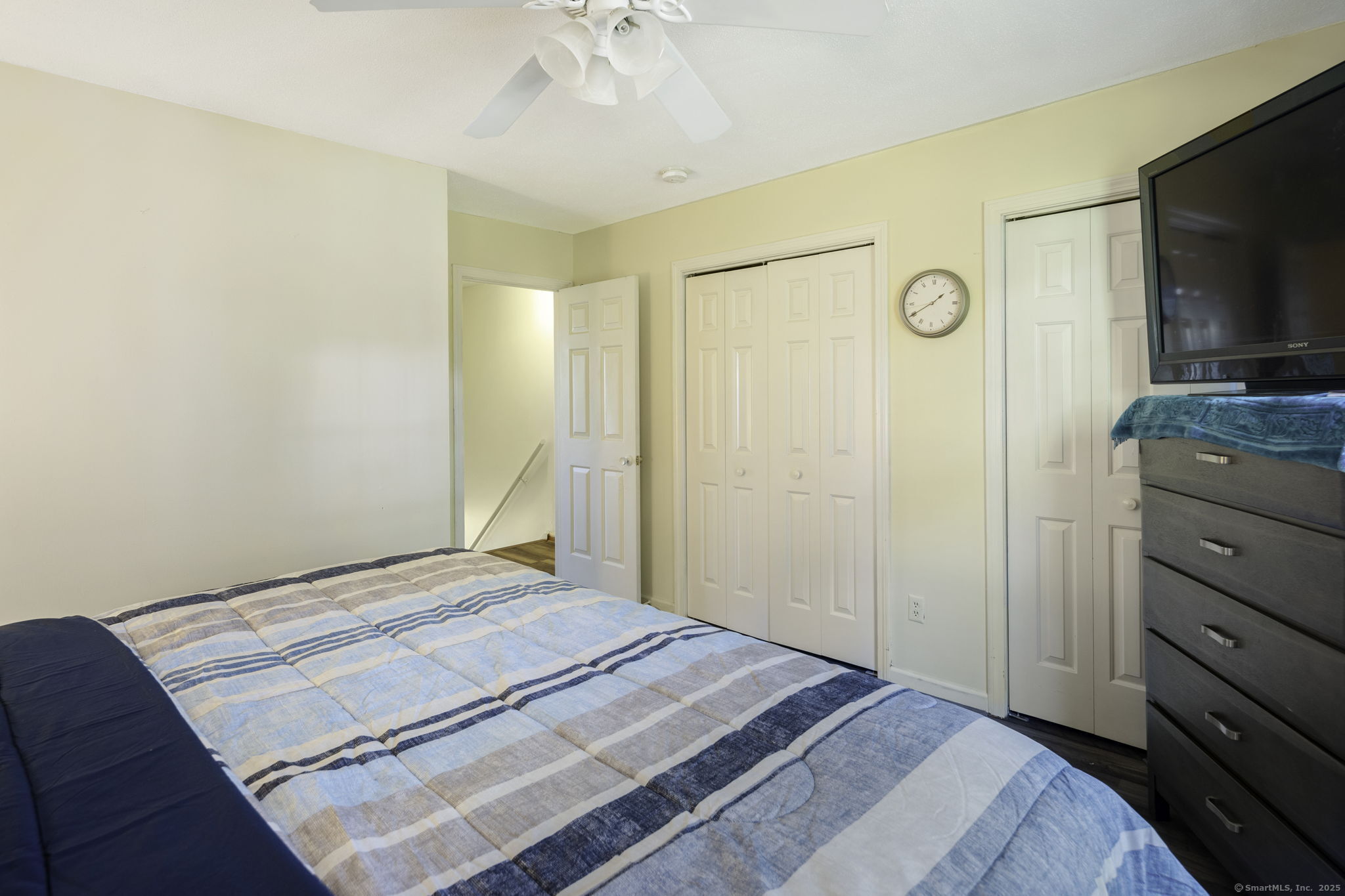 380 Hitchcock Road, Unit 48 Waterbury, CT 06705 - Photo 15 of 28 a bedroom with a bed and a flat screen tv