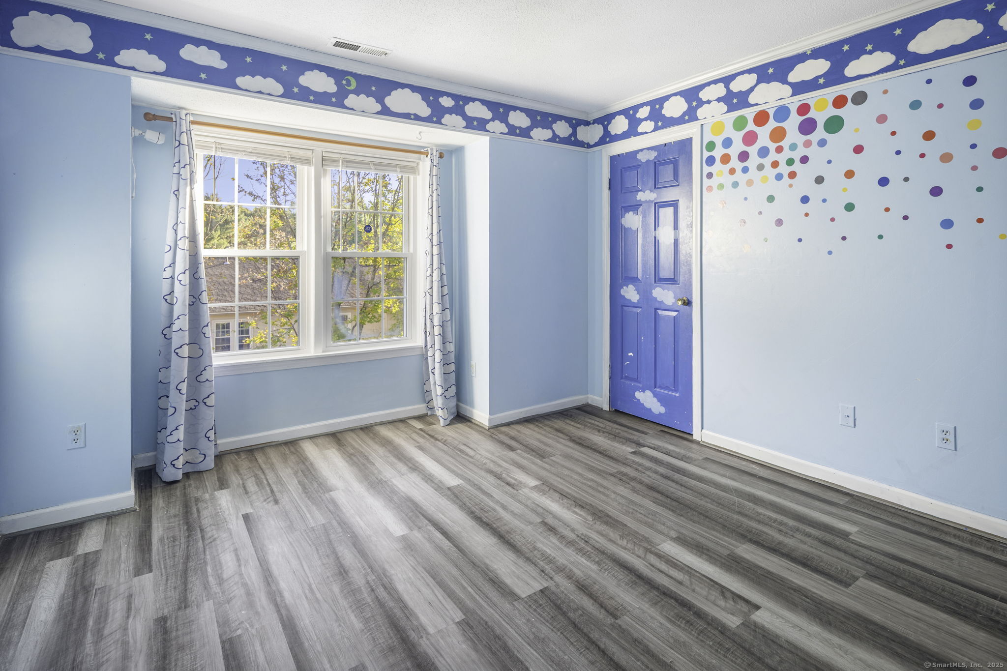380 Hitchcock Road, Unit 48 Waterbury, CT 06705 - Photo 18 of 28 a view of an empty room with wooden floor and a window