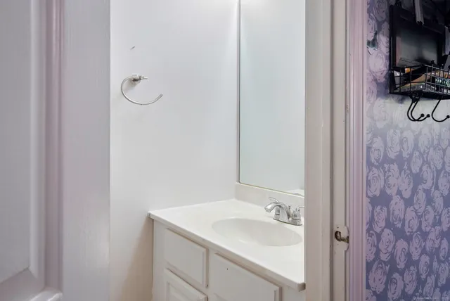 a bathroom with a sink and a mirror