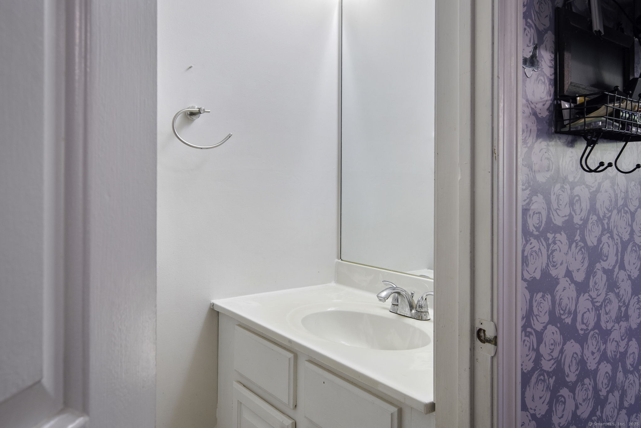 380 Hitchcock Road, Unit 48 Waterbury, CT 06705 - Photo 21 of 28 a bathroom with a sink and a mirror