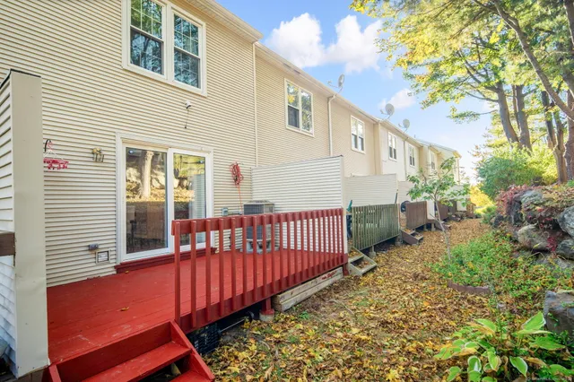 a view of a house with wooden fence