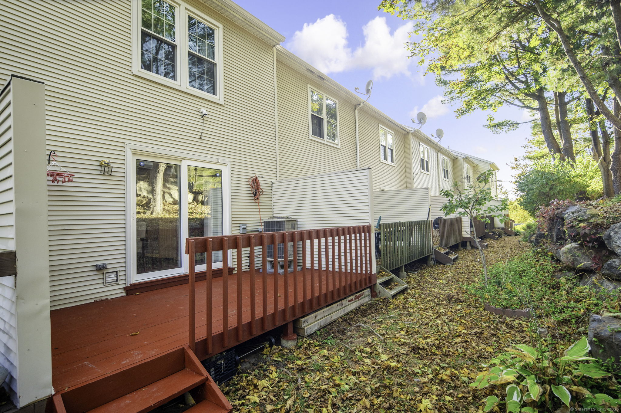 380 Hitchcock Road, Unit 48 Waterbury, CT 06705 - Photo 23 of 28 a view of a house with wooden fence