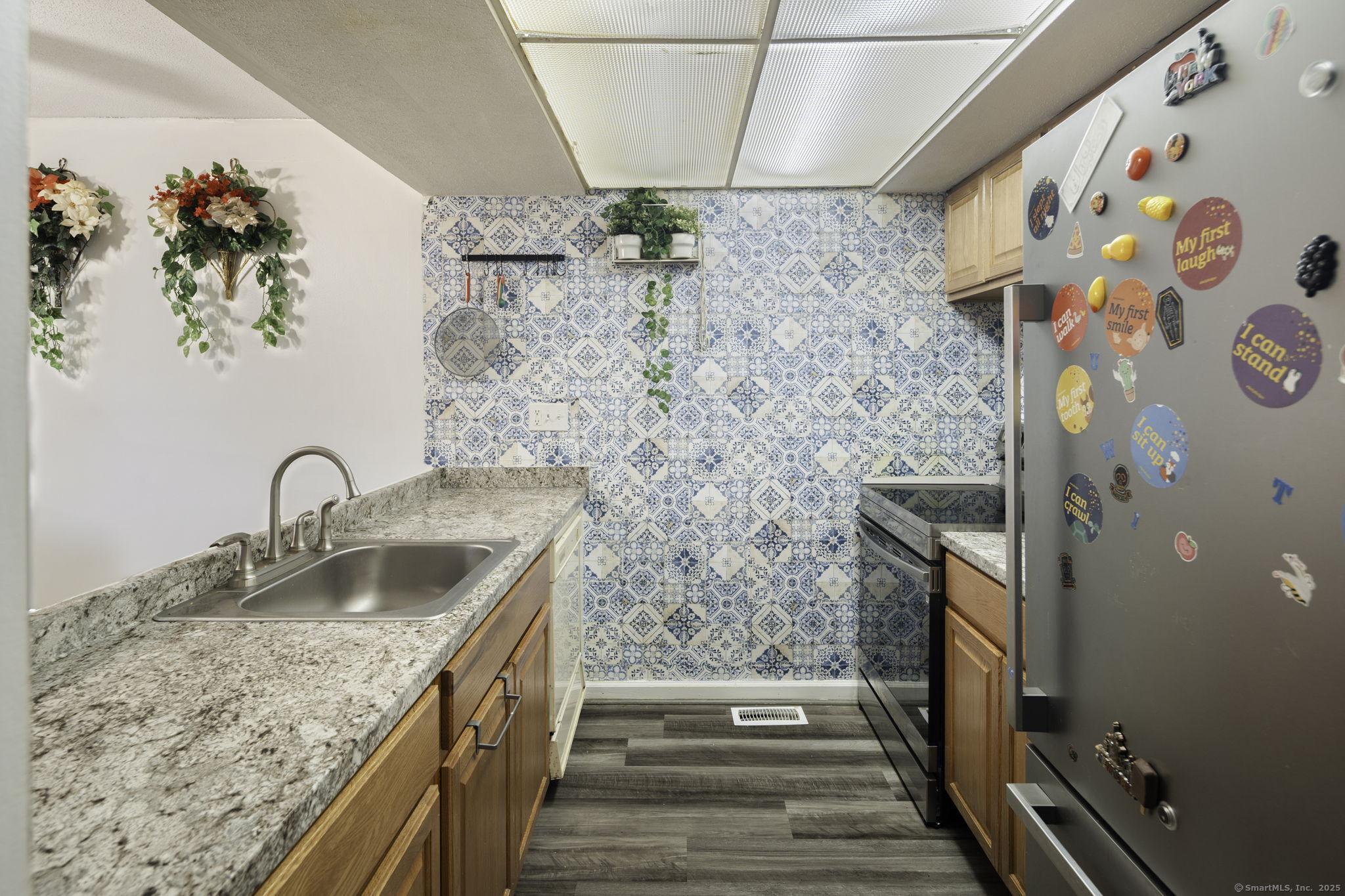 380 Hitchcock Road, Unit 48 Waterbury, CT 06705 - Photo 26 of 28 a bathroom with a granite countertop sink a mirror and shower