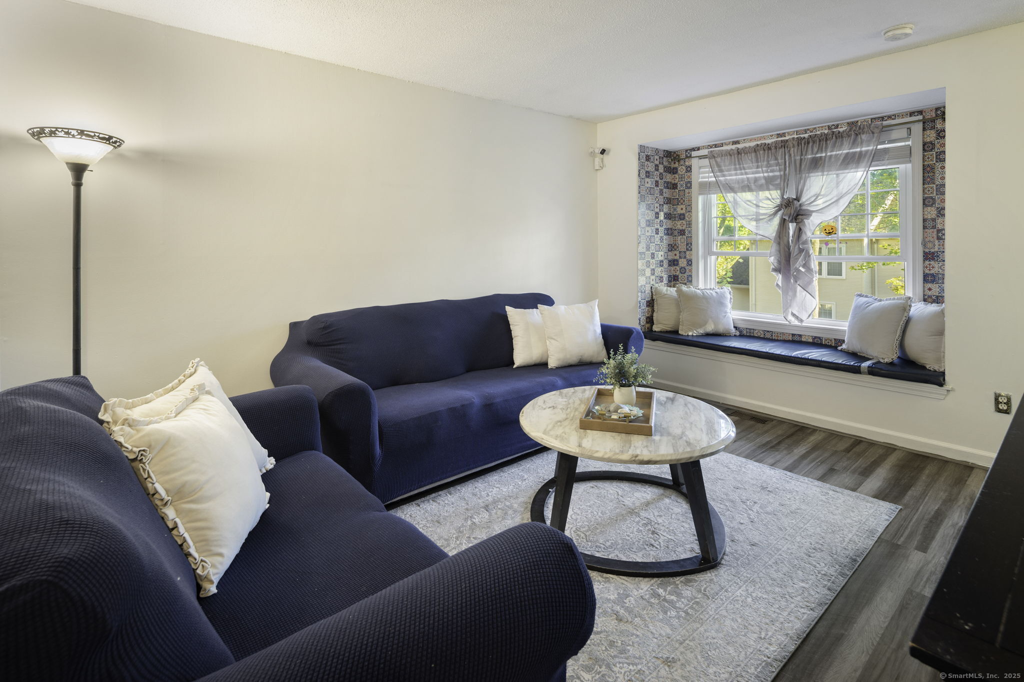 380 Hitchcock Road, Unit 48 Waterbury, CT 06705 - Photo 5 of 28 a living room with furniture and a large window