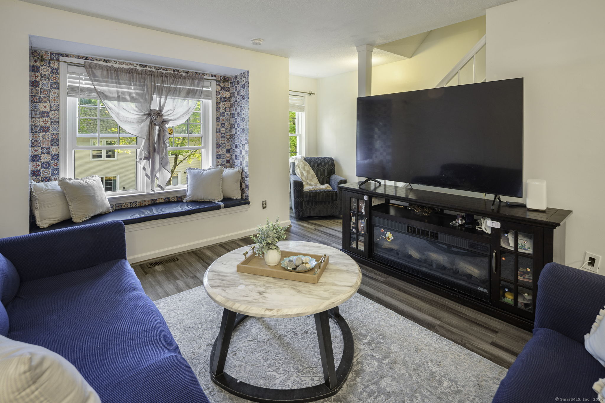 380 Hitchcock Road, Unit 48 Waterbury, CT 06705 - Photo 6 of 28 a living room with furniture and a flat screen tv