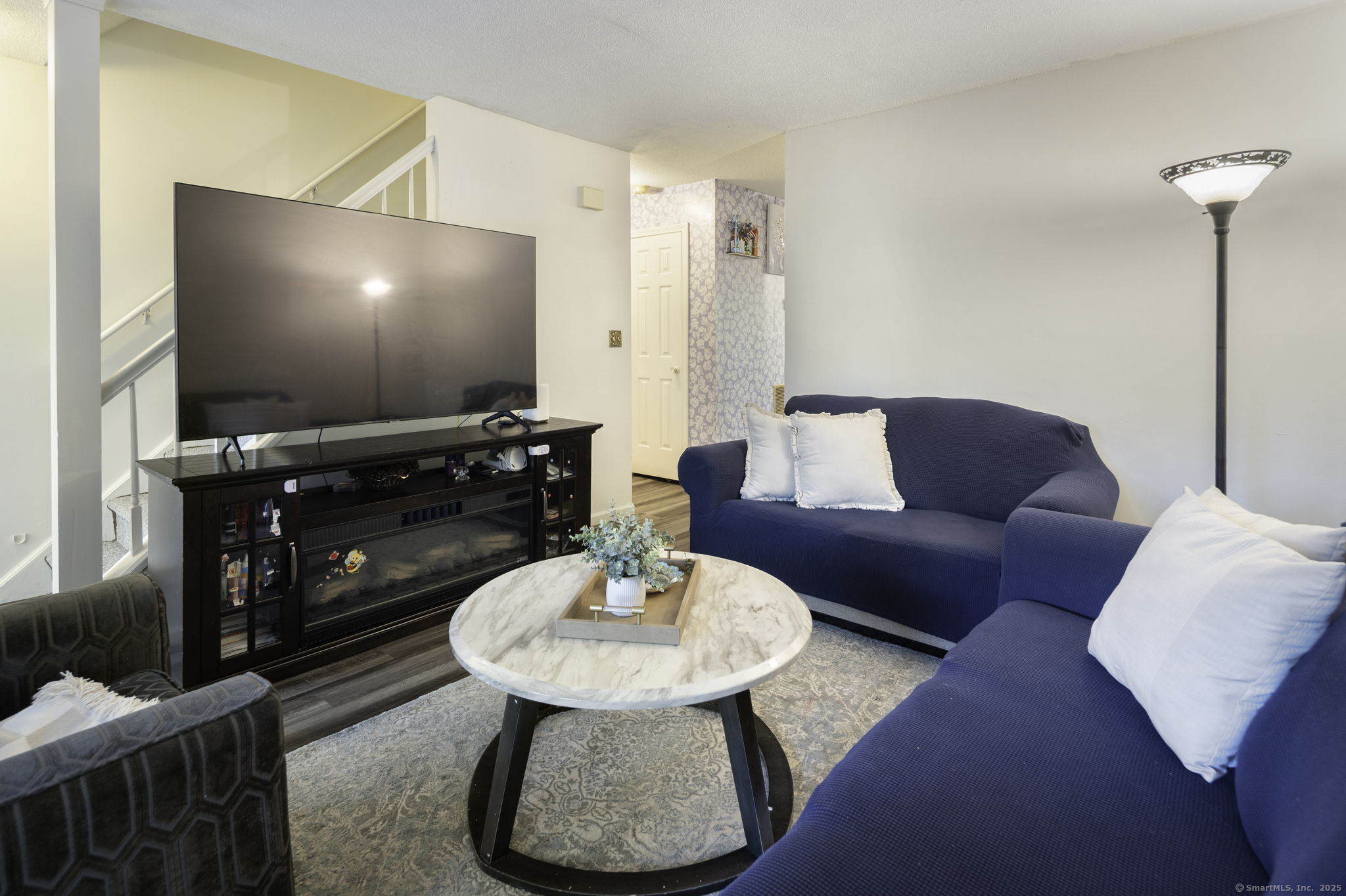 380 Hitchcock Road, Unit 48 Waterbury, CT 06705 - Photo 7 of 28 a living room with furniture and a flat screen tv