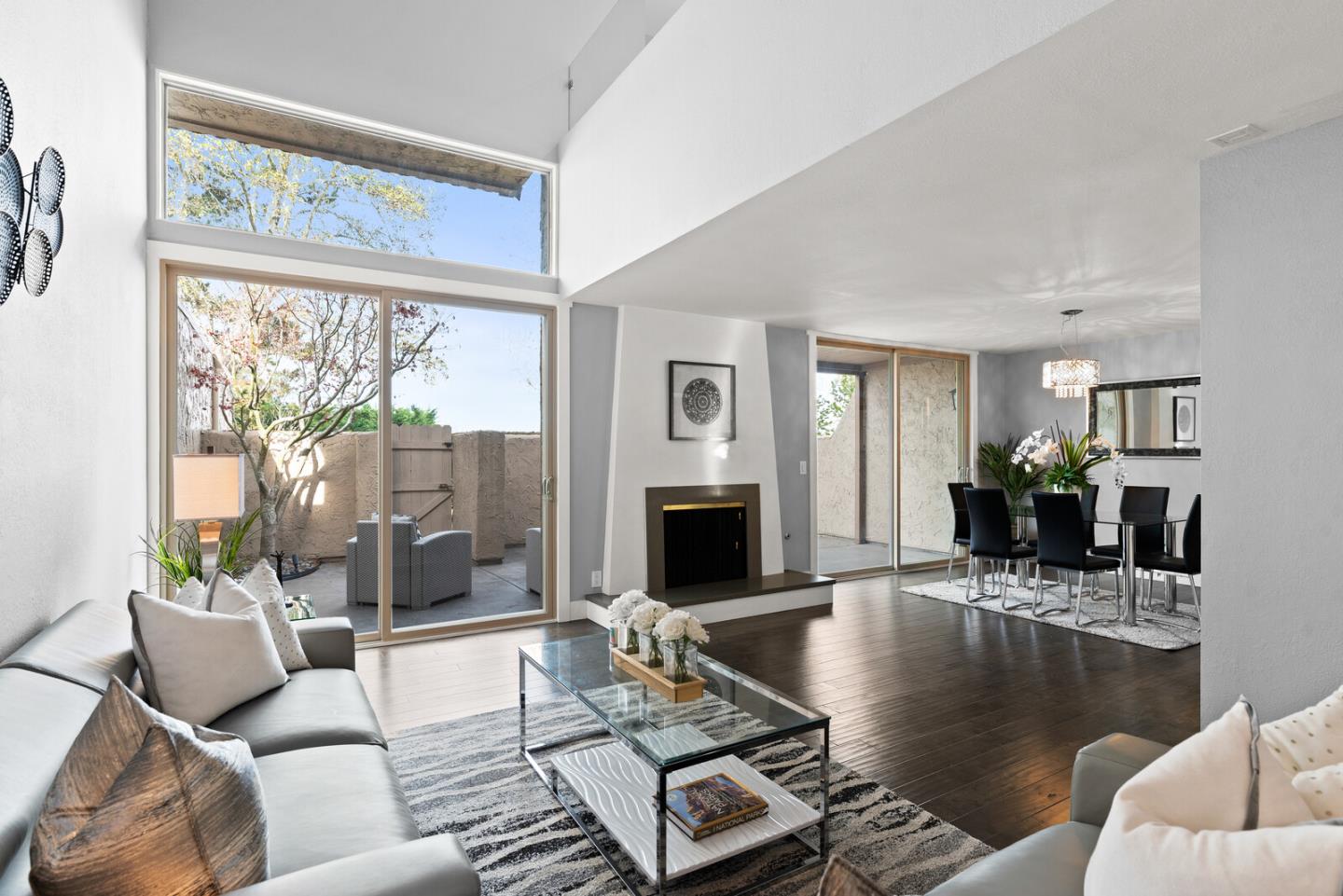 5 Rinconada Circle Belmont, CA 94002 - Photo 1 of 24 a living room with furniture large window and a fireplace