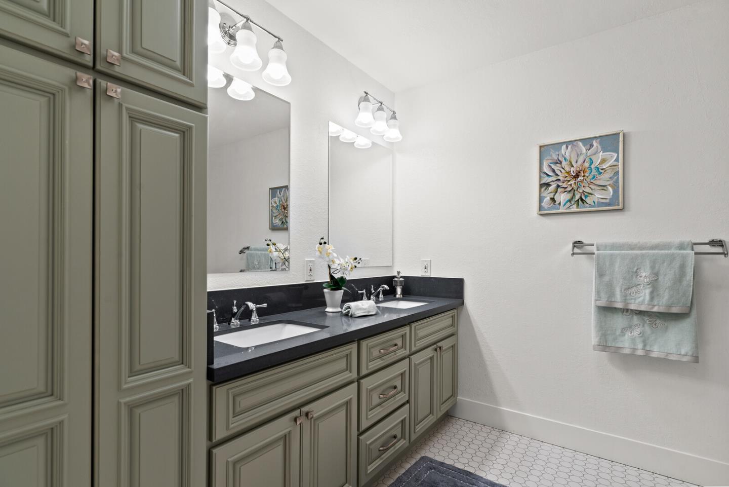 5 Rinconada Circle Belmont, CA 94002 - Photo 16 of 24 a bathroom with a double vanity sink and a mirror