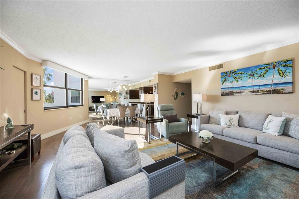 1050 Longboat Club Road, Unit 204 Longboat Key, FL 34228 - Photo 15 of 64 a living room with furniture and wooden floor