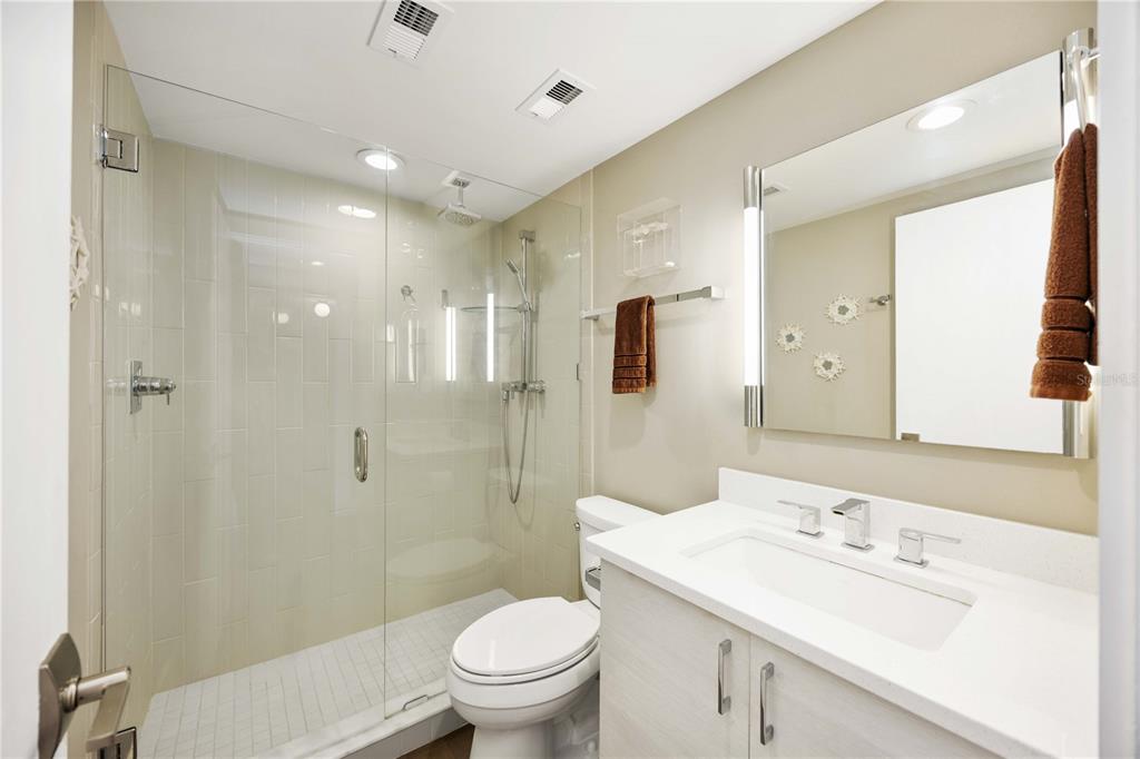 1050 Longboat Club Road, Unit 204 Longboat Key, FL 34228 - Photo 23 of 64 a bathroom with a sink toilet vanity and shower