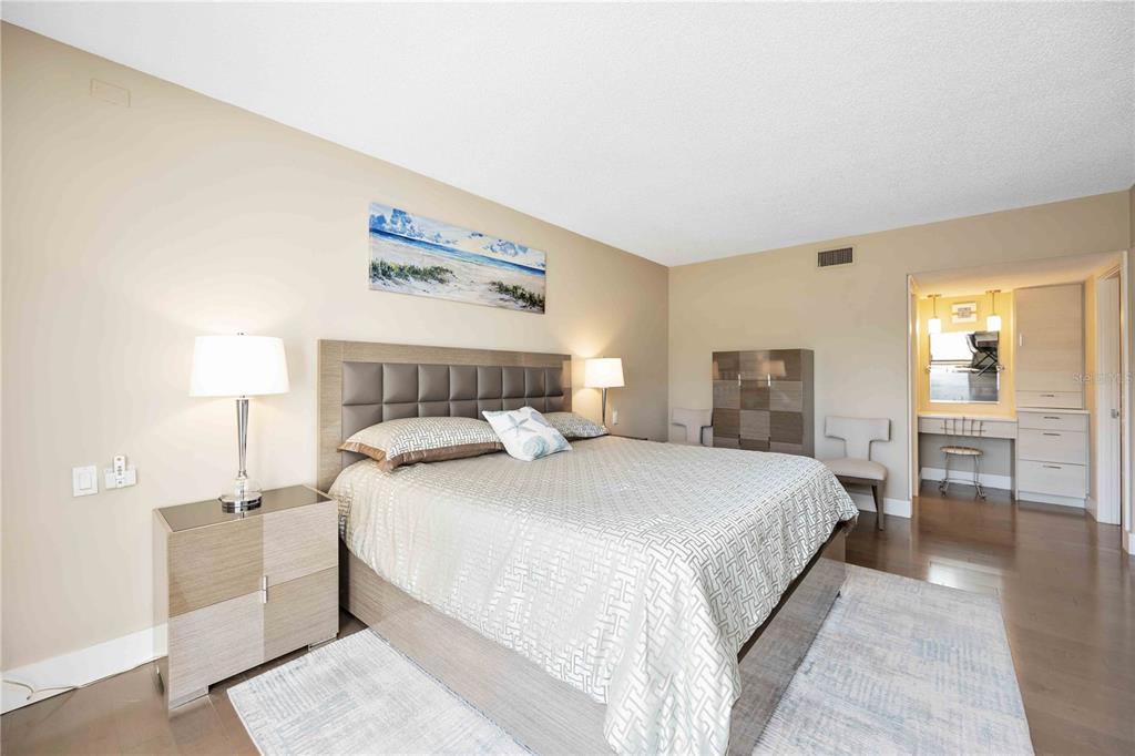 1050 Longboat Club Road, Unit 204 Longboat Key, FL 34228 - Photo 28 of 64 a bedroom with a bed and a couch