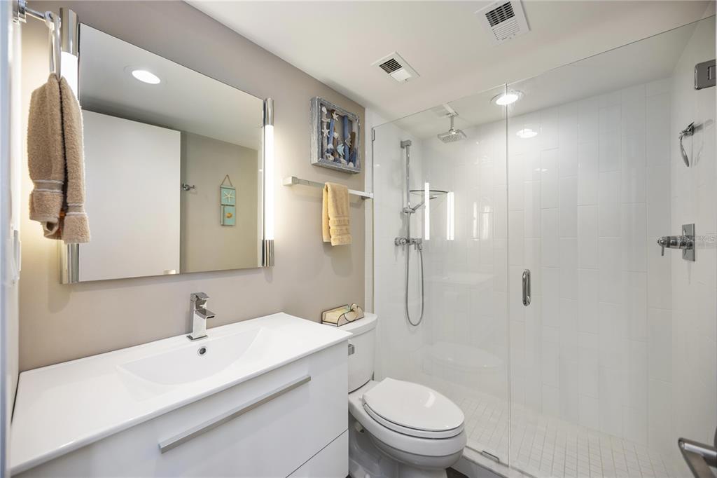 1050 Longboat Club Road, Unit 204 Longboat Key, FL 34228 - Photo 30 of 64 a bathroom with a sink a toilet and shower