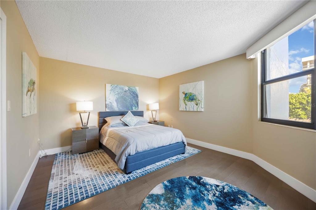 1050 Longboat Club Road, Unit 204 Longboat Key, FL 34228 - Photo 31 of 64 a bedroom with double bed and a window