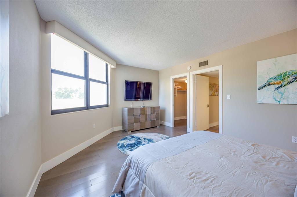 1050 Longboat Club Road, Unit 204 Longboat Key, FL 34228 - Photo 33 of 64 a bedroom with a bed and a window