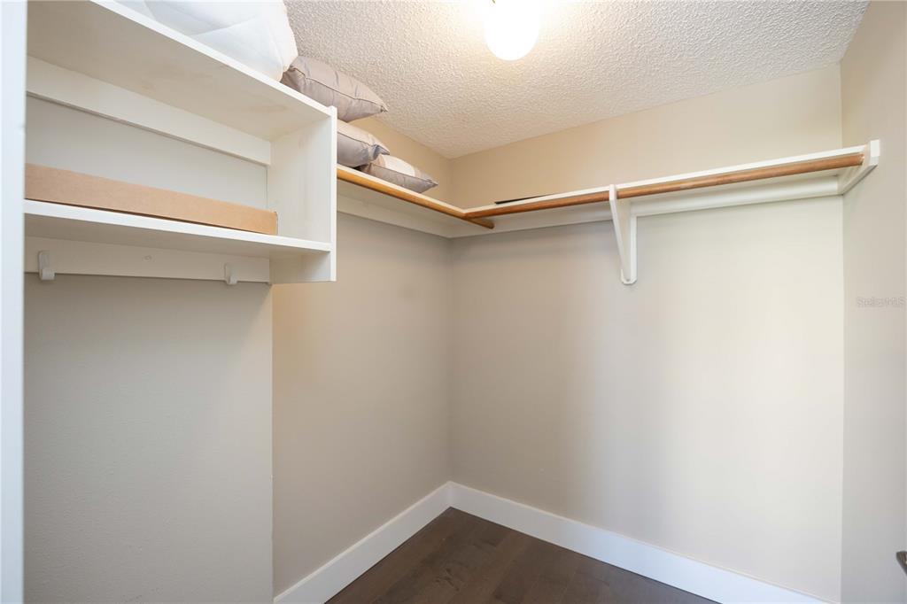 1050 Longboat Club Road, Unit 204 Longboat Key, FL 34228 - Photo 35 of 64 a view of an empty walk in closet