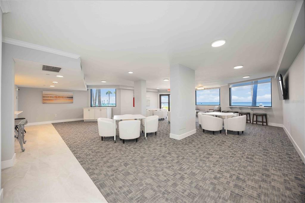 1050 Longboat Club Road, Unit 204 Longboat Key, FL 34228 - Photo 39 of 64 a living room with furniture and a large window