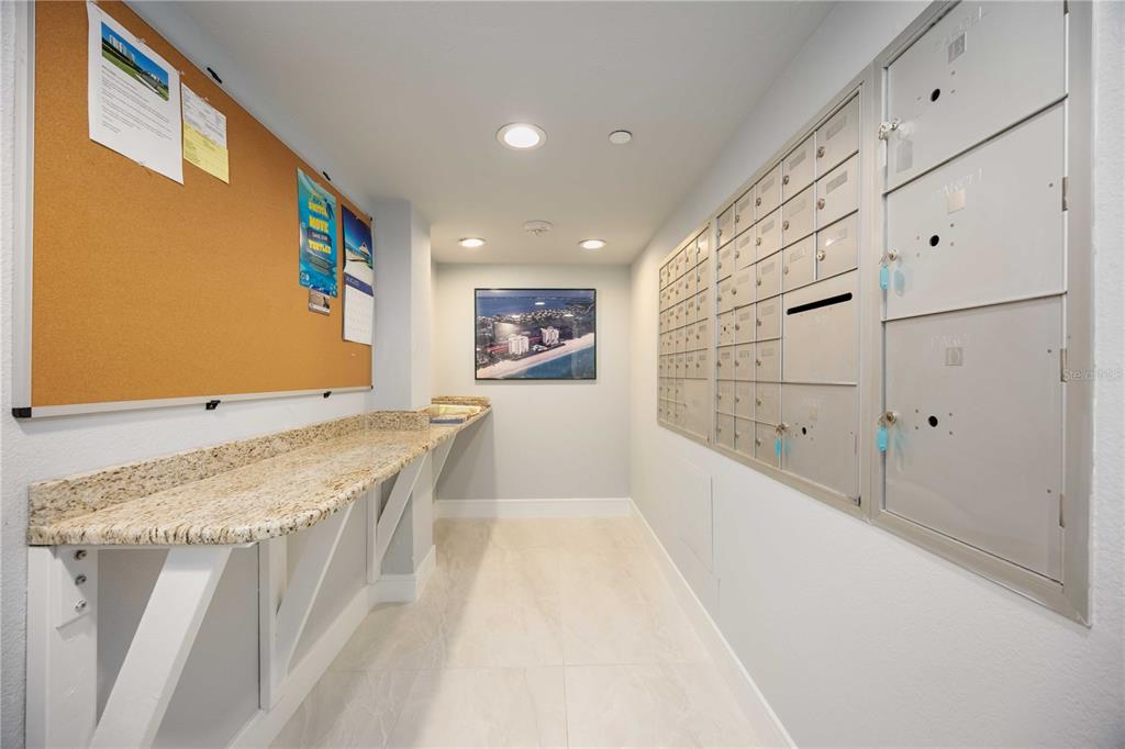 1050 Longboat Club Road, Unit 204 Longboat Key, FL 34228 - Photo 41 of 64 a spacious bathroom with a granite countertop sink