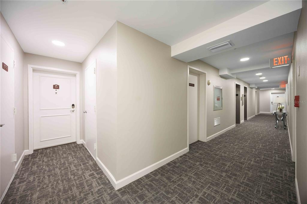 1050 Longboat Club Road, Unit 204 Longboat Key, FL 34228 - Photo 8 of 64 a view of hallway