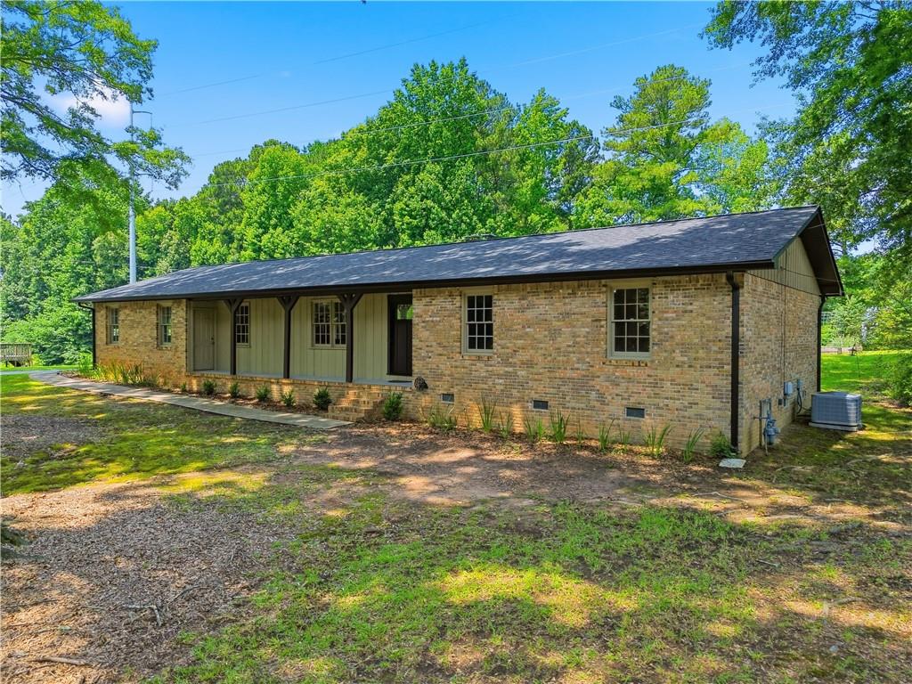 125 Childers Road Canton, GA 30115 - Photo 4 of 48 a view of a house with a yard